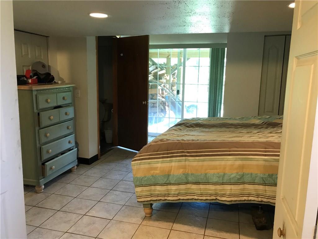 120 Cable Road New Brighton, PA 15066 - Photo 11 of 24 Lower level bedroom with sliders leading to patio