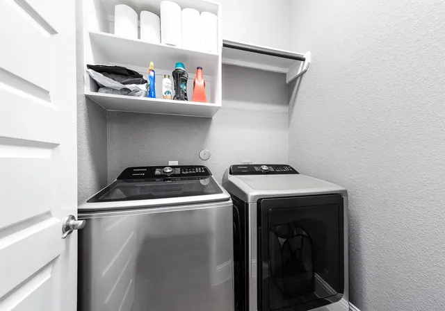 a utility room with dryer and washer