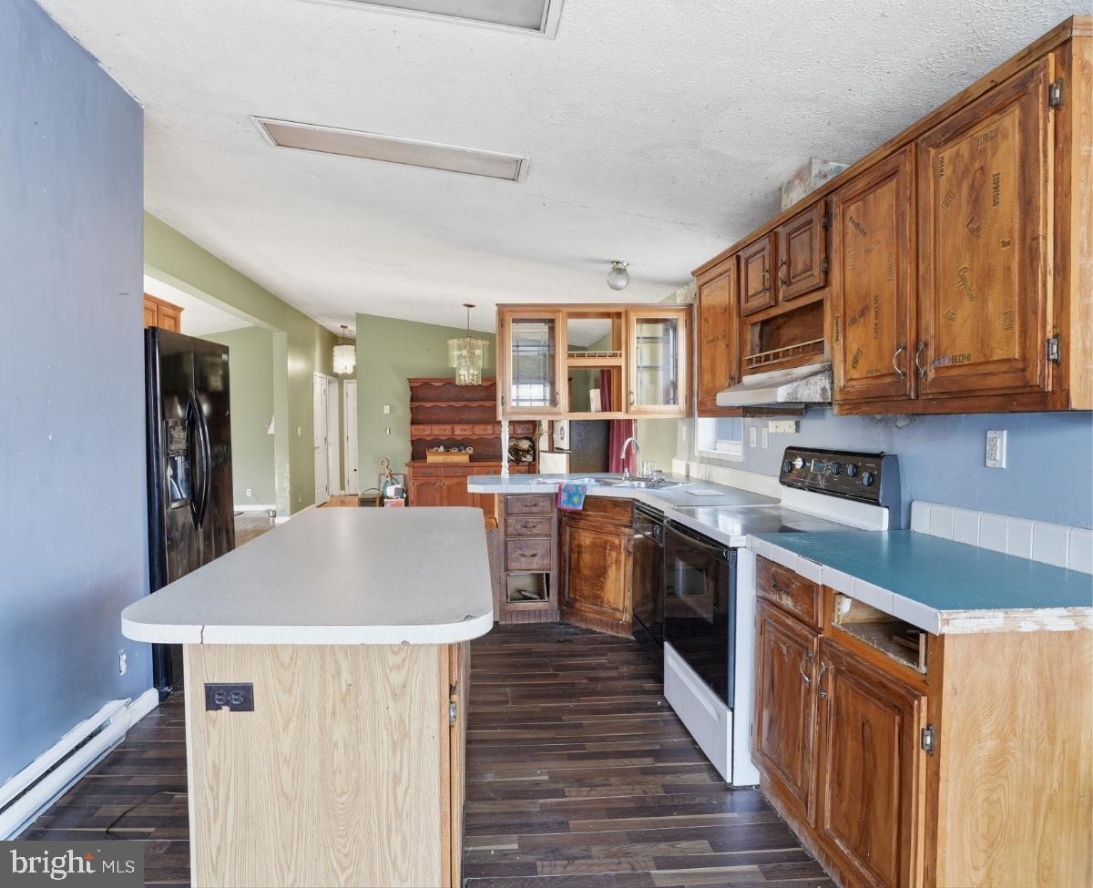 105 Ceramic Drive Newfoundland, PA 18445 - Photo 14 of 45 Charming kitchen with rustic cabinetry.
