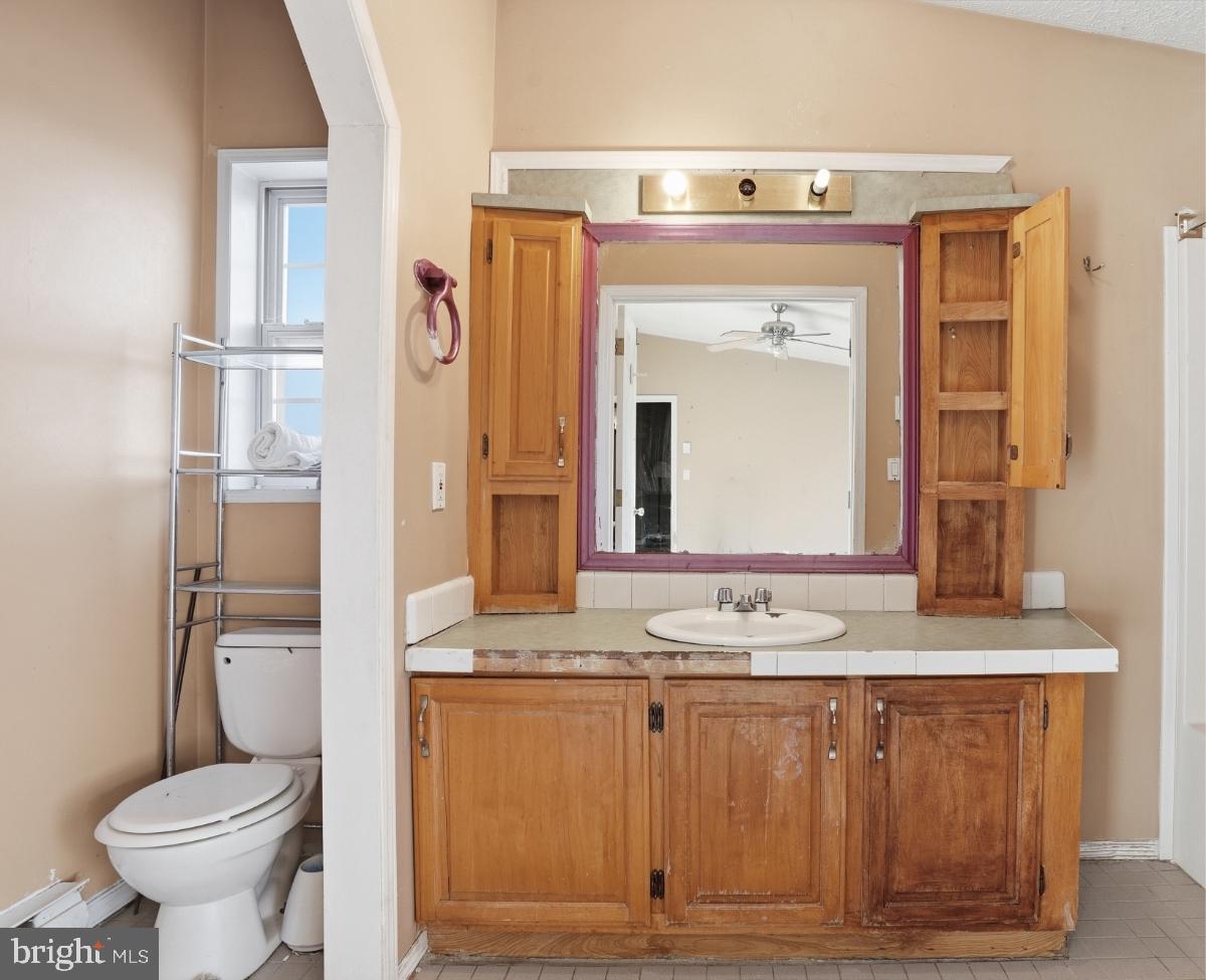 105 Ceramic Drive Newfoundland, PA 18445 - Photo 22 of 45 Charming bathroom with rustic cabinetry.