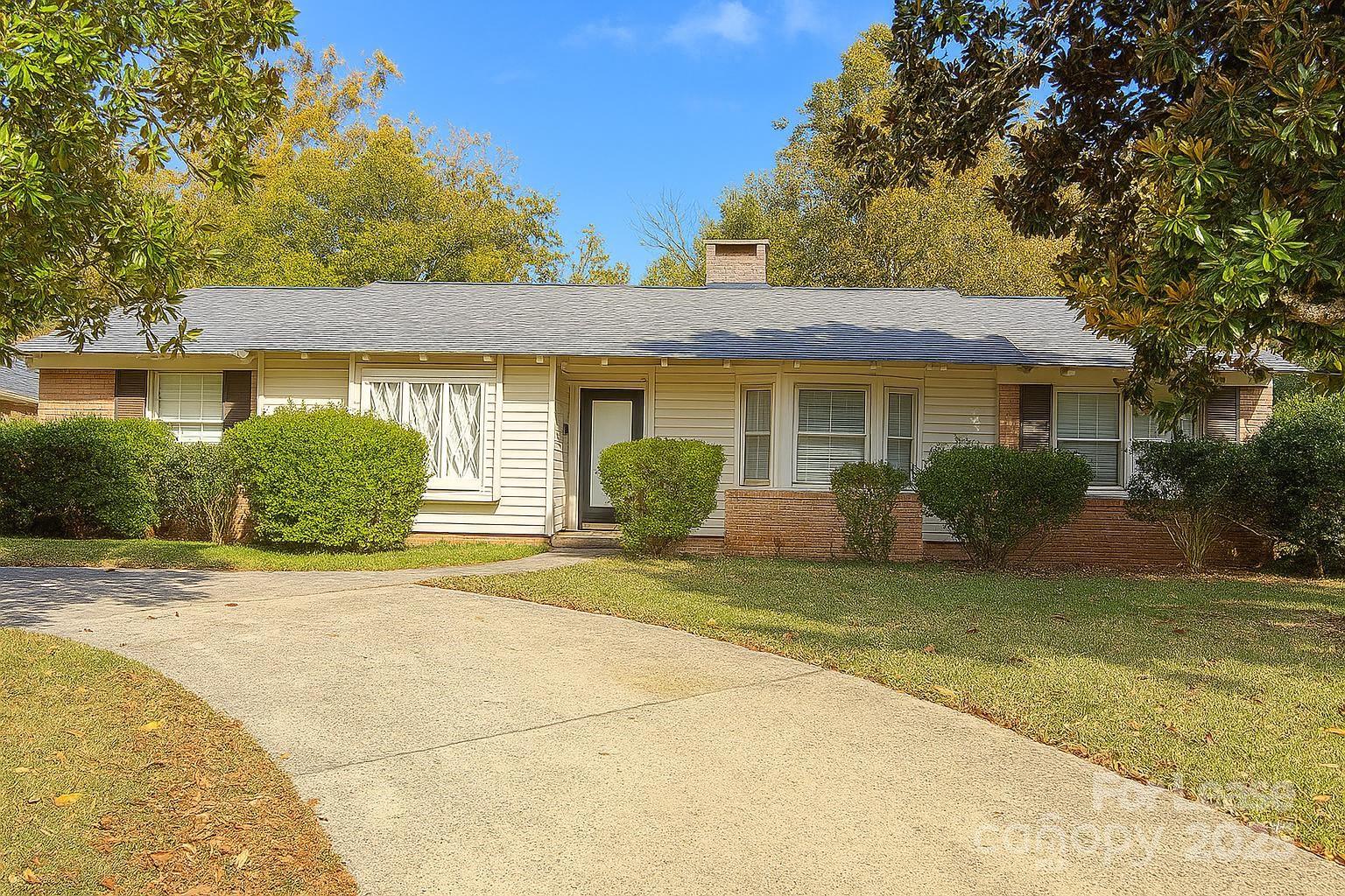 2025 Tyvola Road Charlotte, NC 28210 - Photo 1 of 16 a view of a house with a outdoor space