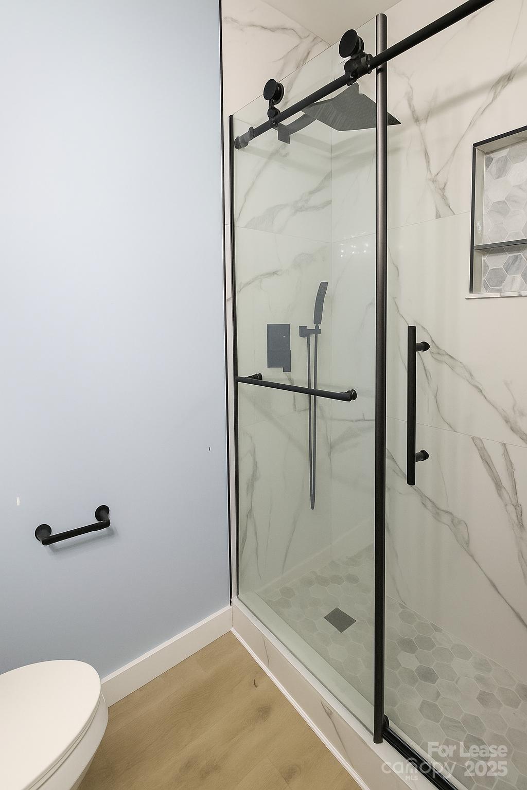 2025 Tyvola Road Charlotte, NC 28210 - Photo 14 of 16 a bathroom with a shower