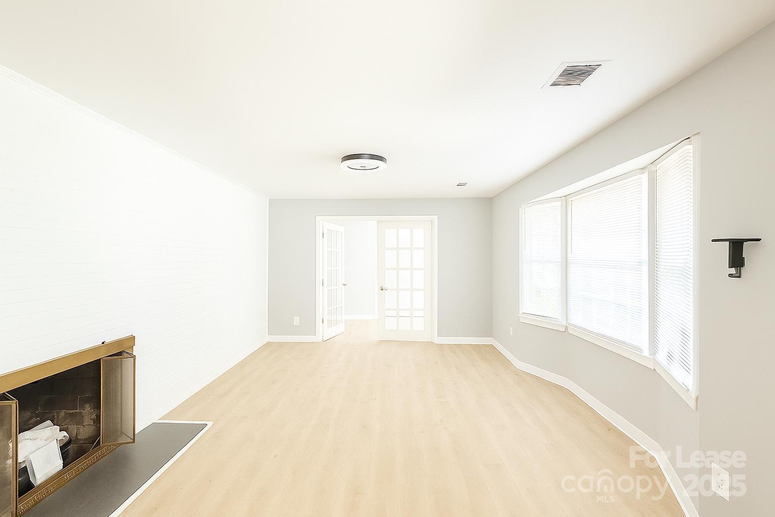 2025 Tyvola Road Charlotte, NC 28210 - Photo 3 of 16 a view of an empty room with a window