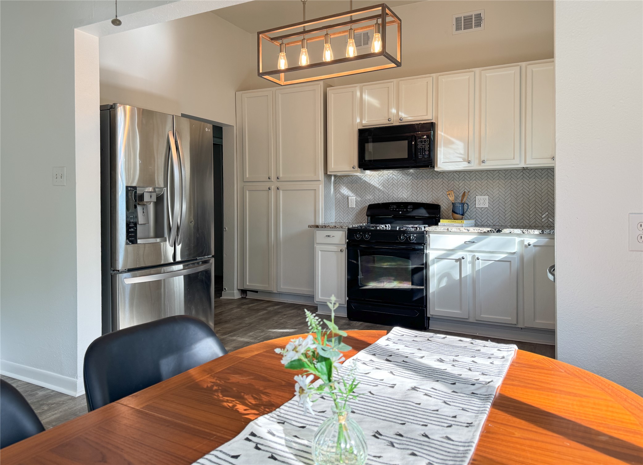 302 East Brenham Street Elgin, TX 78621 - Photo 13 of 38 View of kitchen from dining area