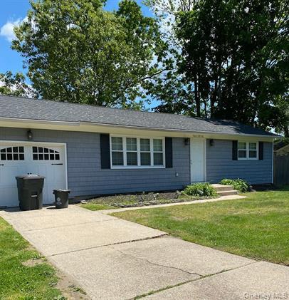 a view of house with yard
