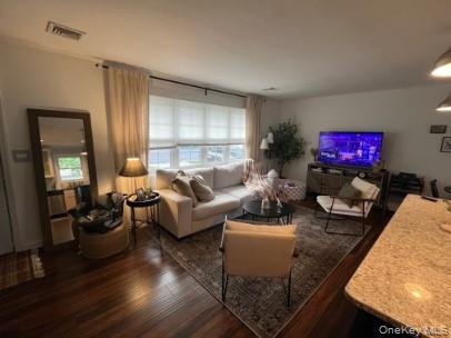 1241 Stony Brook Road Lake Grove, NY 11755 - Photo 5 of 10 a living room with furniture and wooden floor