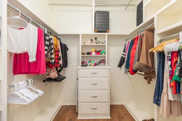 a spacious bathroom with a double vanity sink and a mirror