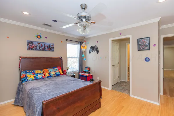 a backyard of a house with lots of green space and fountain