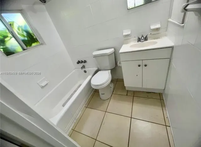 a bathroom with a sink a toilet and vanity