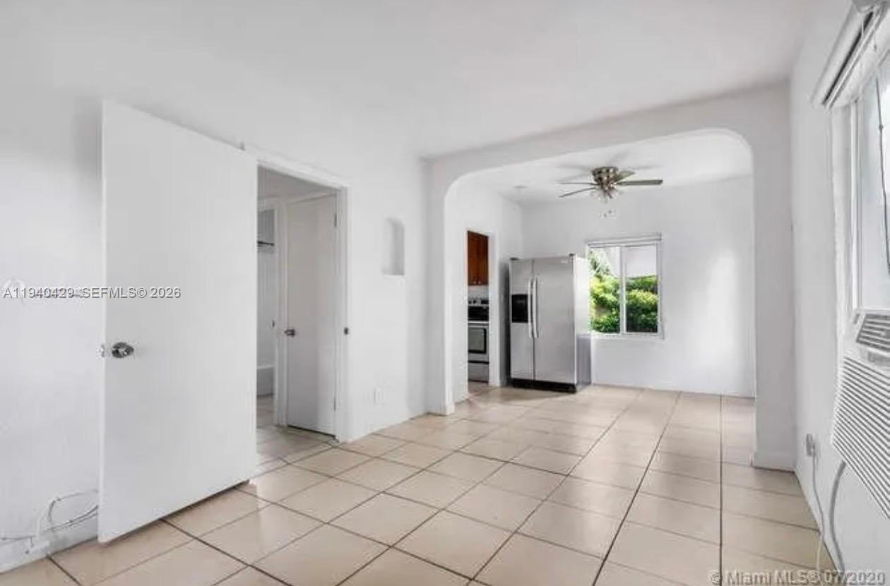 128 Northwest 53rd Street Miami, FL 33127 - Photo 16 of 22 a view of an empty room and window