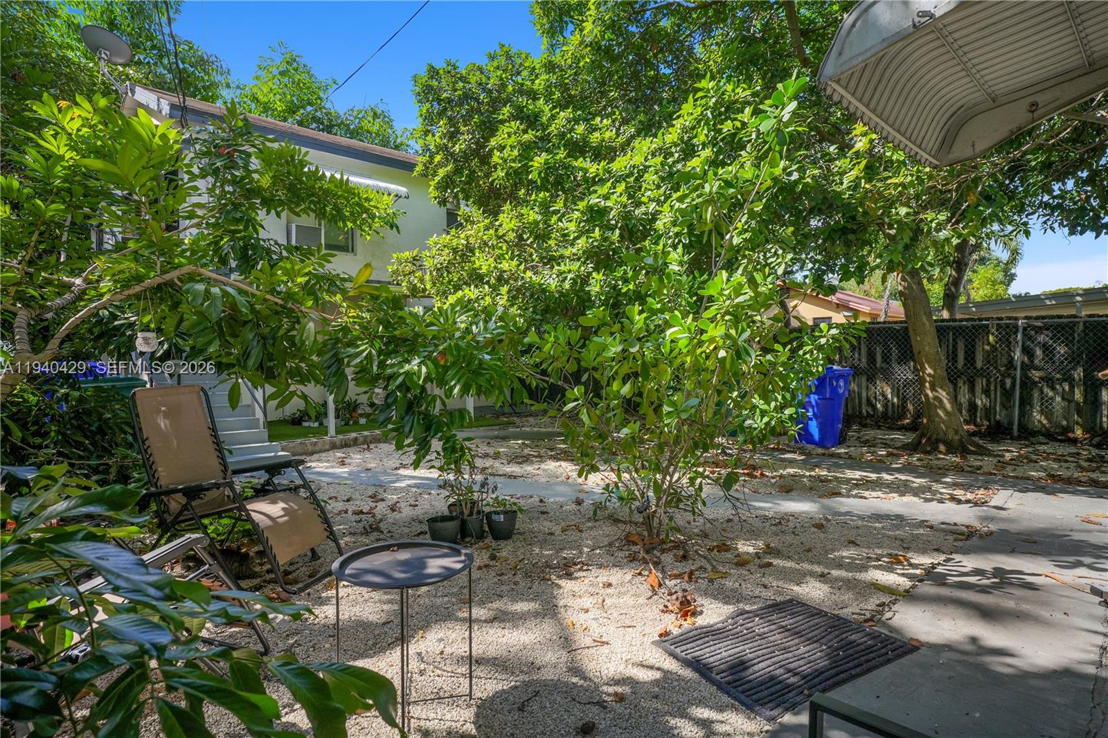 128 Northwest 53rd Street Miami, FL 33127 - Photo 17 of 22 a view of backyard with sitting area