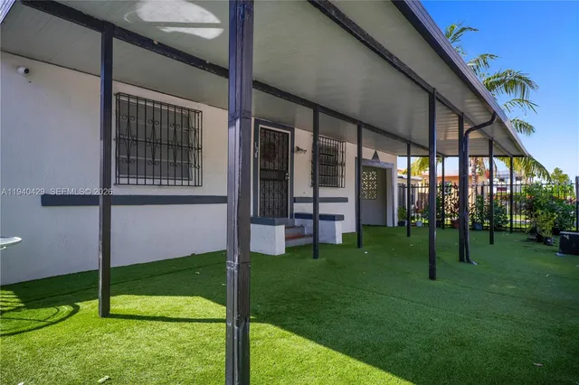 a view of yard with small cabin