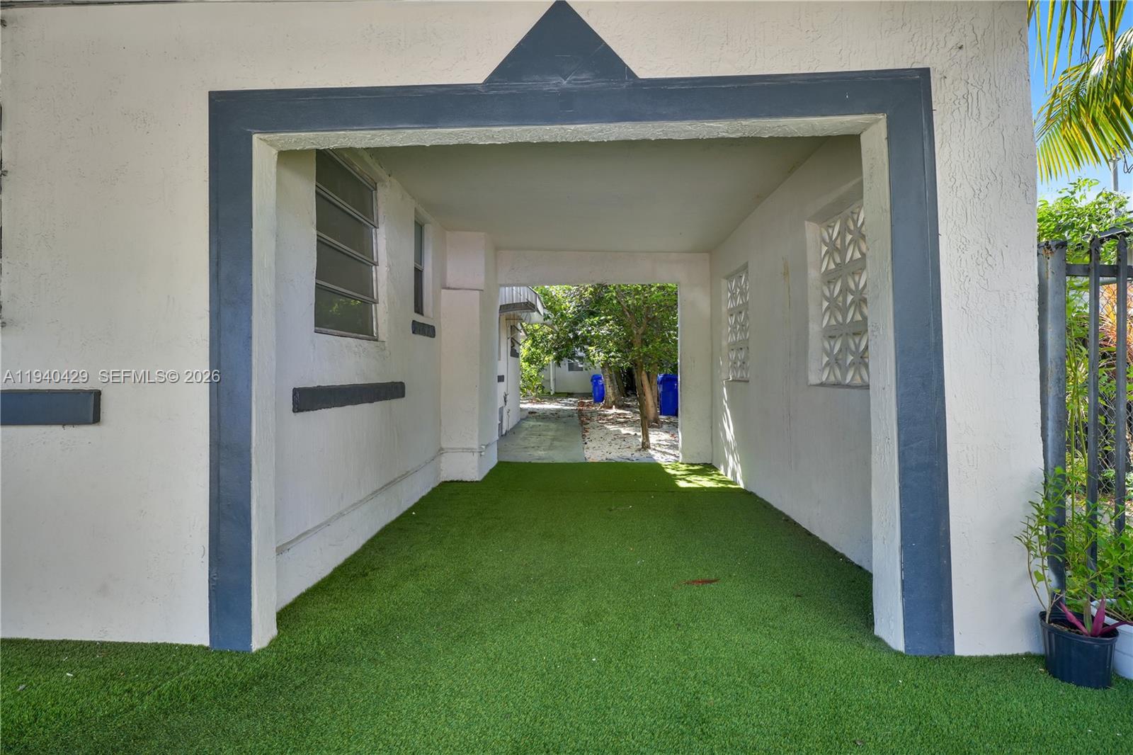 128 Northwest 53rd Street Miami, FL 33127 - Photo 7 of 22 a view of a porch with a yard