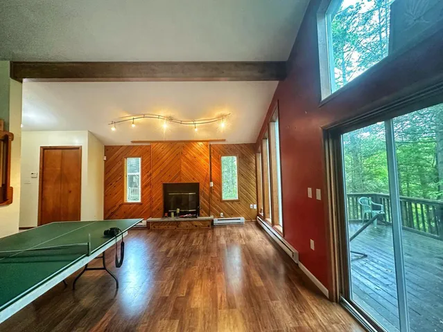 a view of a living room and hardwood floor