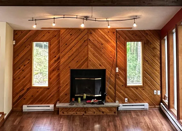 a view of room with a window and wooden floor