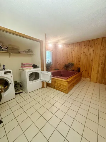 a living room with a couch and a stove top oven