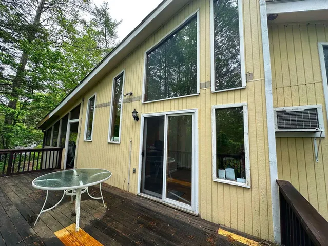 a view of a chair and table in the balcony