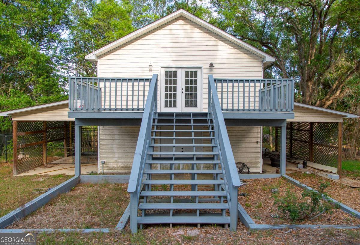 528 Gardner Road Baxley, GA 31513 - Photo 13 of 39 a front view of a house with a balcony