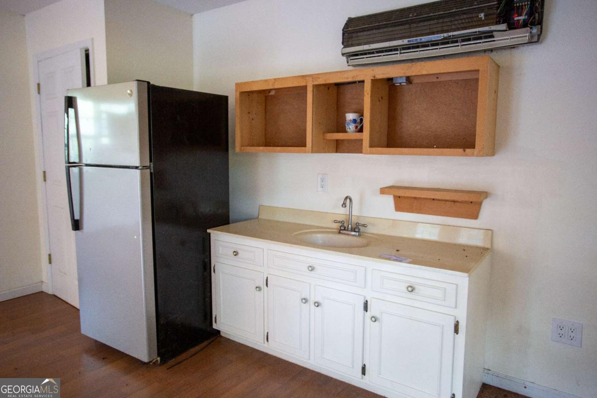 528 Gardner Road Baxley, GA 31513 - Photo 16 of 39 a kitchen with a refrigerator sink and microwave