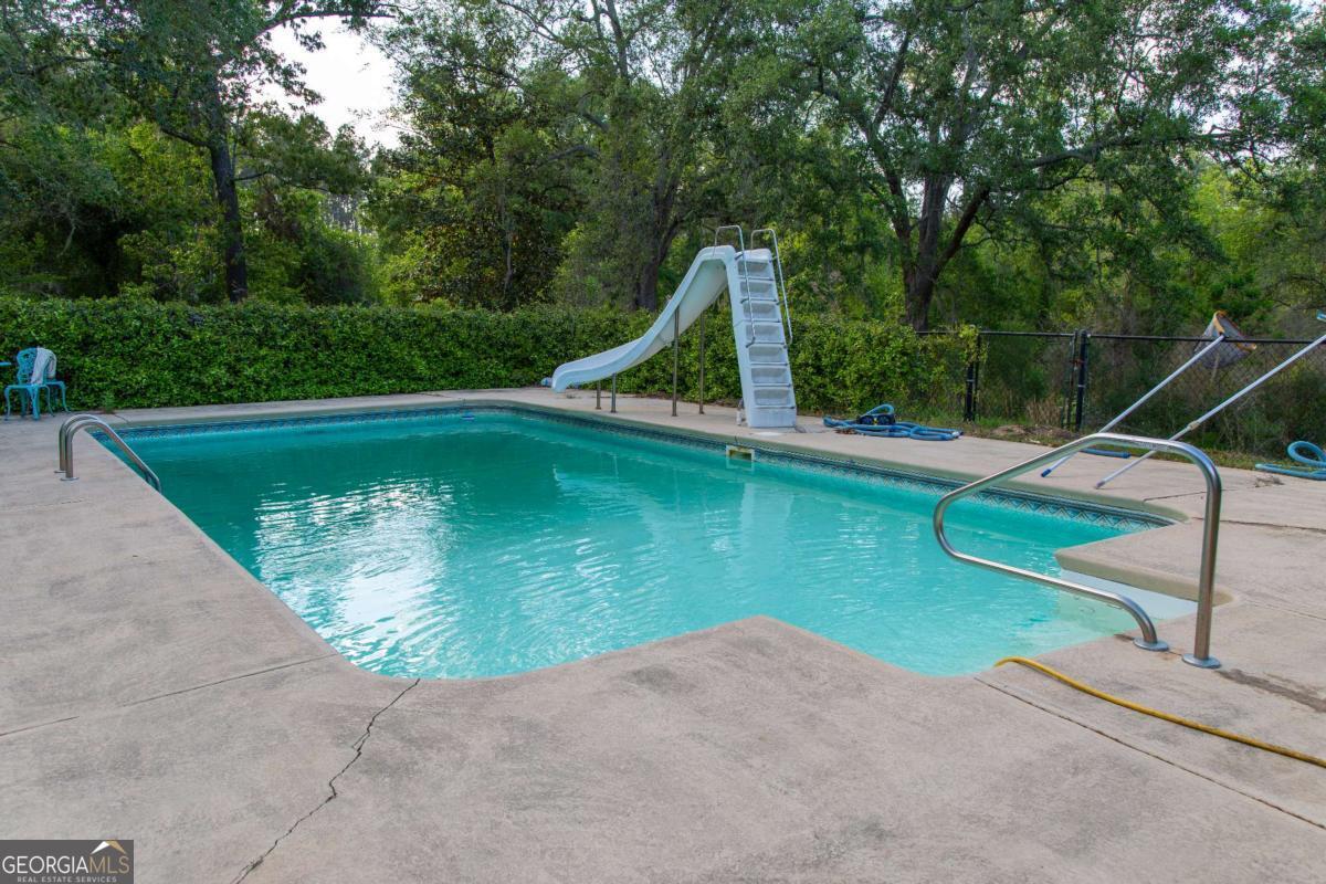 528 Gardner Road Baxley, GA 31513 - Photo 18 of 39 a view of a backyard with swimming pool