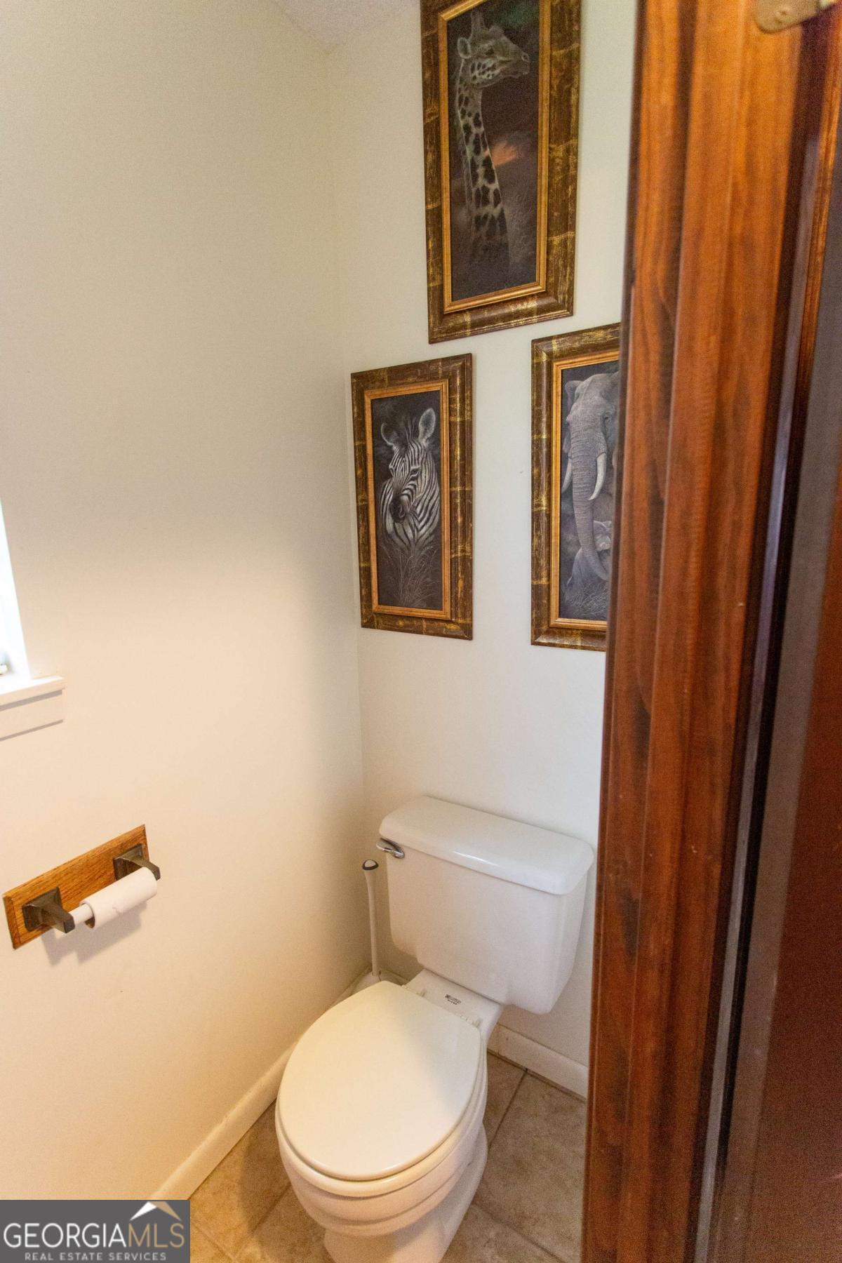 528 Gardner Road Baxley, GA 31513 - Photo 23 of 39 a white toilet sitting next to a shower curtain