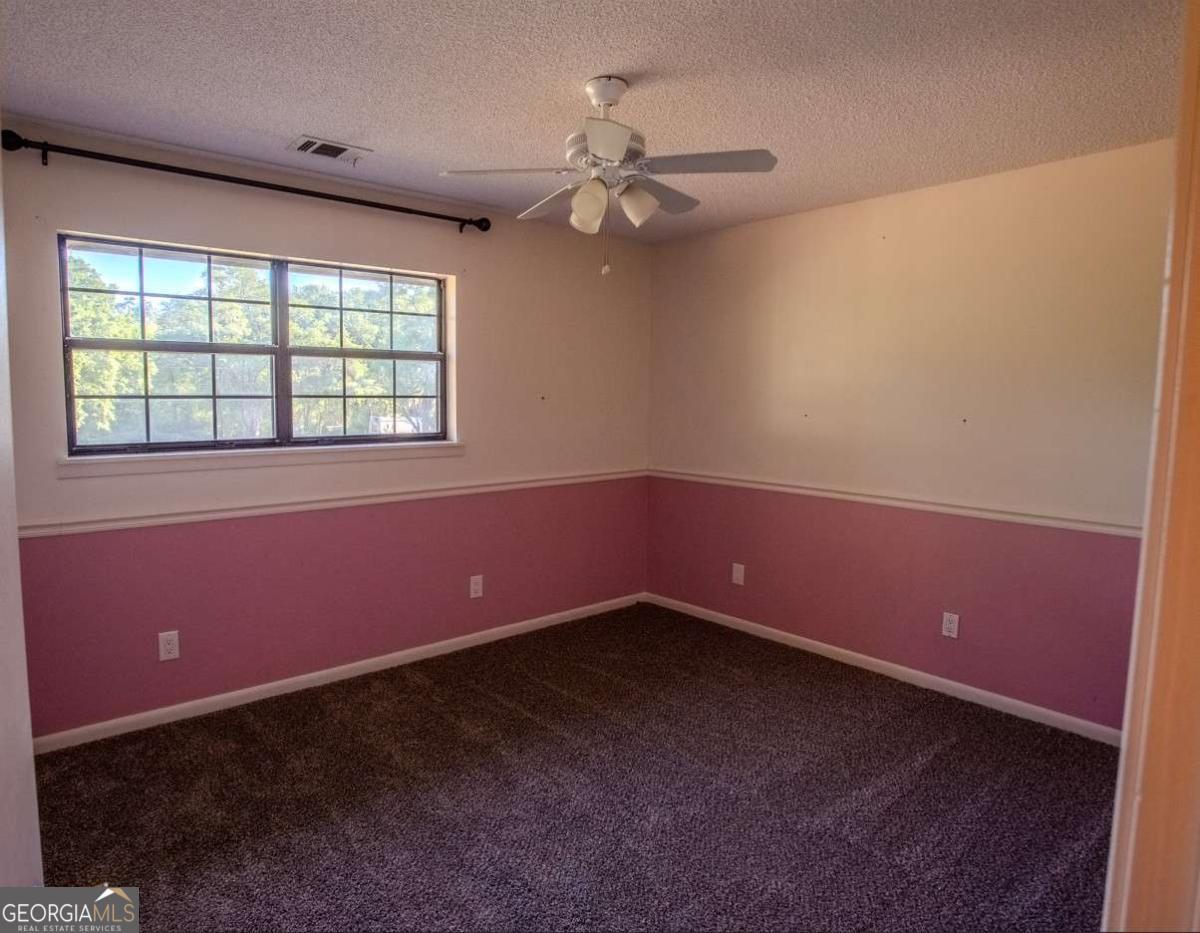 528 Gardner Road Baxley, GA 31513 - Photo 35 of 39 an empty room with a window