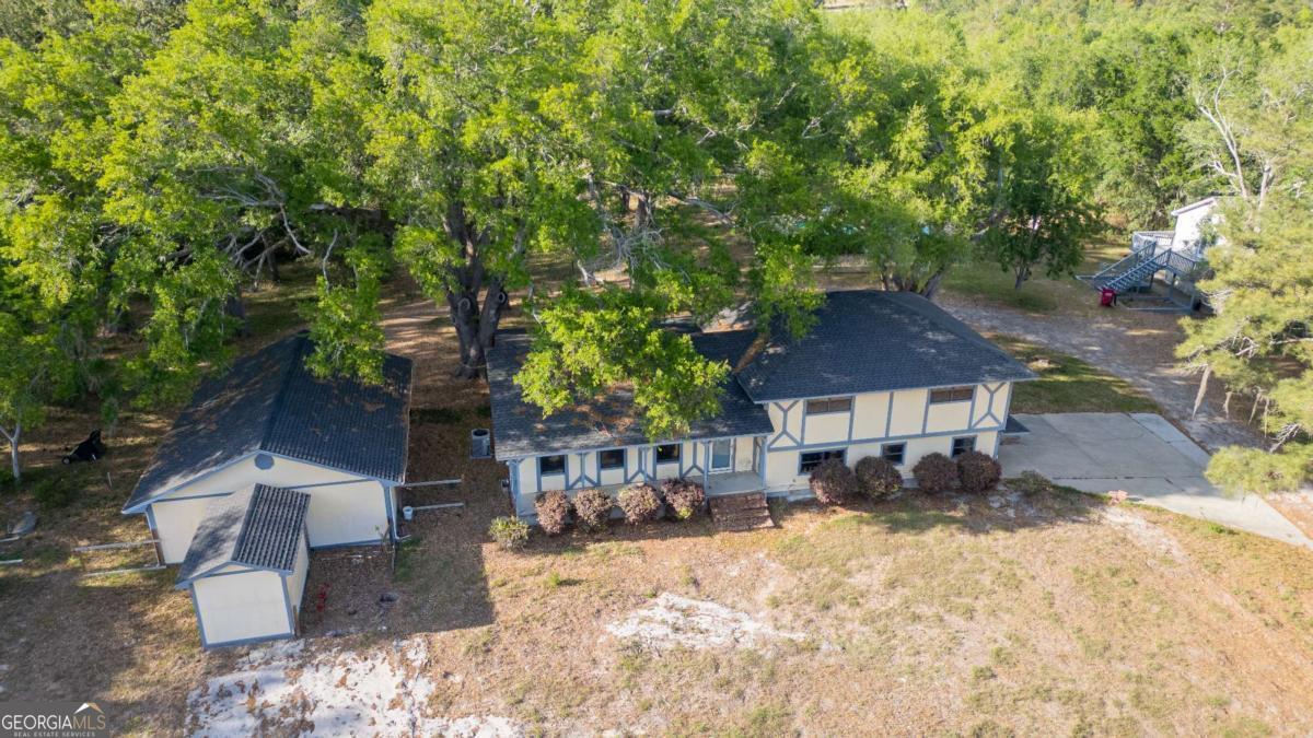 528 Gardner Road Baxley, GA 31513 - Photo 4 of 39 a view of a house with a yard covered in snow