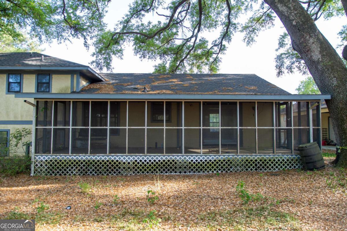 528 Gardner Road Baxley, GA 31513 - Photo 8 of 39 a front view of a house with a garden