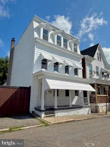 a front view of residential houses with street