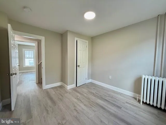 a view of a hallway with windows and stairs