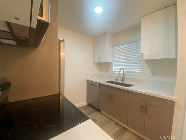 a kitchen with a sink and cabinets