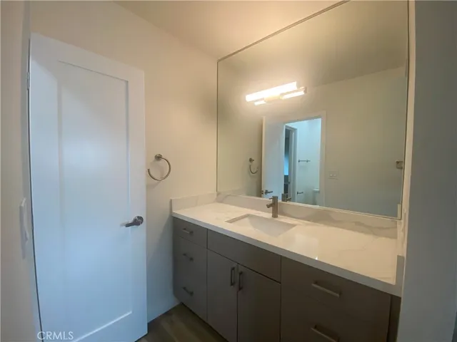 a bathroom with a sink and mirror