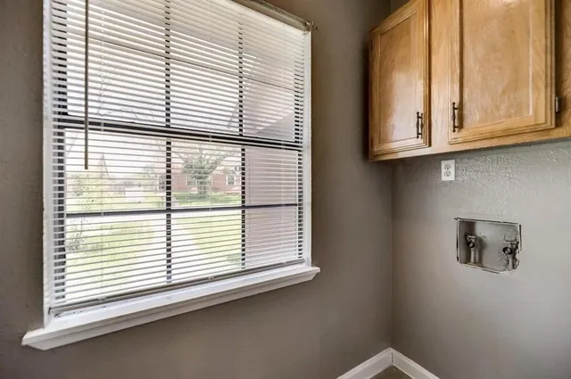an ocean view with wooden floor and a window