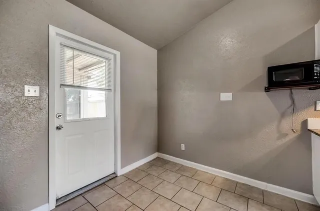 a view of an empty room and window