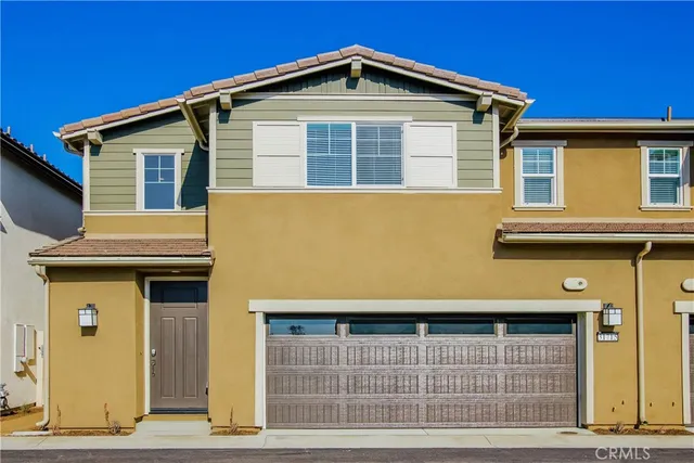 a front view of a house with a garage