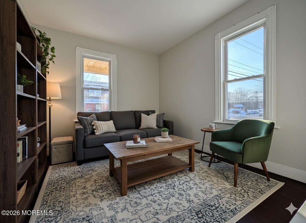 101-103 Ridge Avenue Asbury Park, NJ 07712 - Photo 3 of 11 a living room with furniture and a window