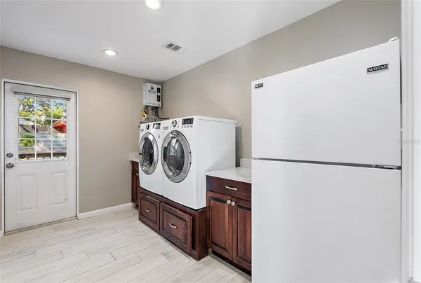 a utility room with dryer and washer