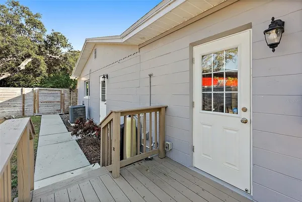 a view of balcony and deck with wooden floor and fence