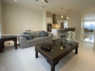 a living room with furniture and a table