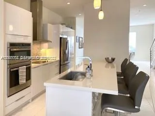 a kitchen with cabinets and appliances