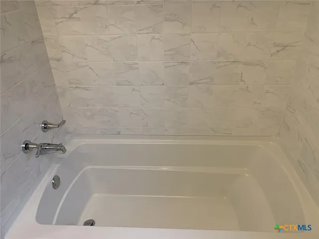 a view of a bathtub in a bathroom