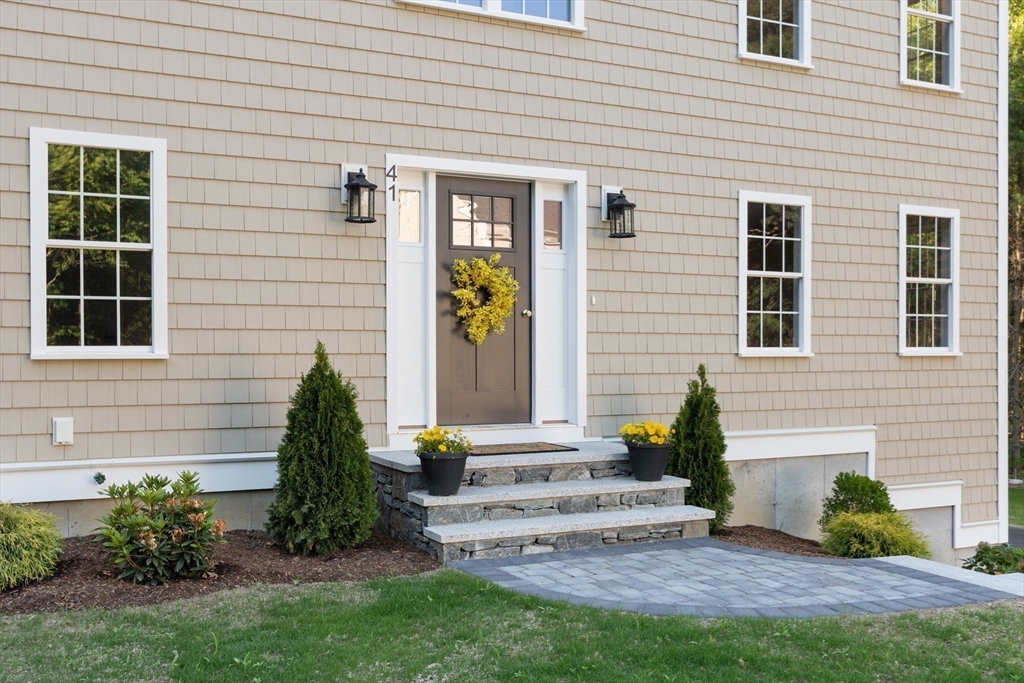 41 Martin Road Douglas, MA 01516 - Photo 8 of 40 a front view of a house with a garden