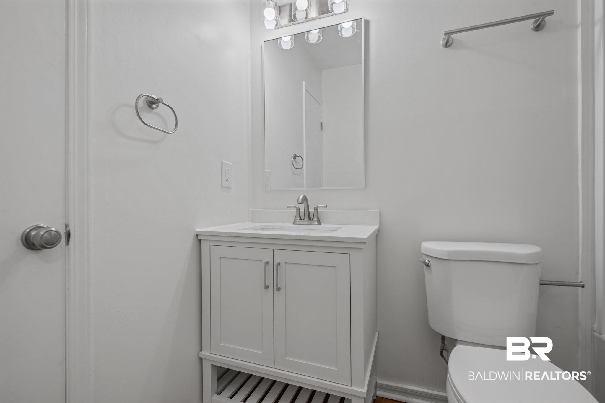 5734 Pheasant Court Theodore, AL 36582 - Photo 10 of 23 Half bathroom featuring vanity and toilet