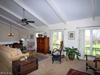 972 Winchell Road Aurora, OH 44202 - Photo 12 of 23 Beamed ceilings add character to the upper level Great Room with tons of natural light.