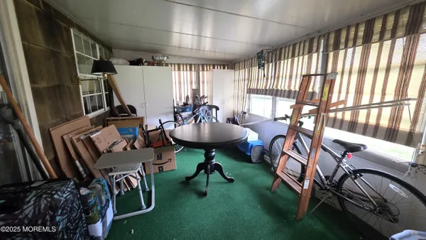a view of a livingroom with furniture and a rug