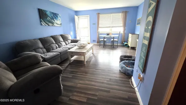a living room with furniture and a table