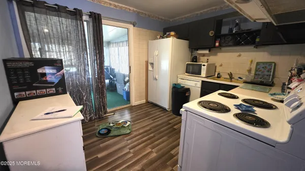 a kitchen with a stove and a refrigerator