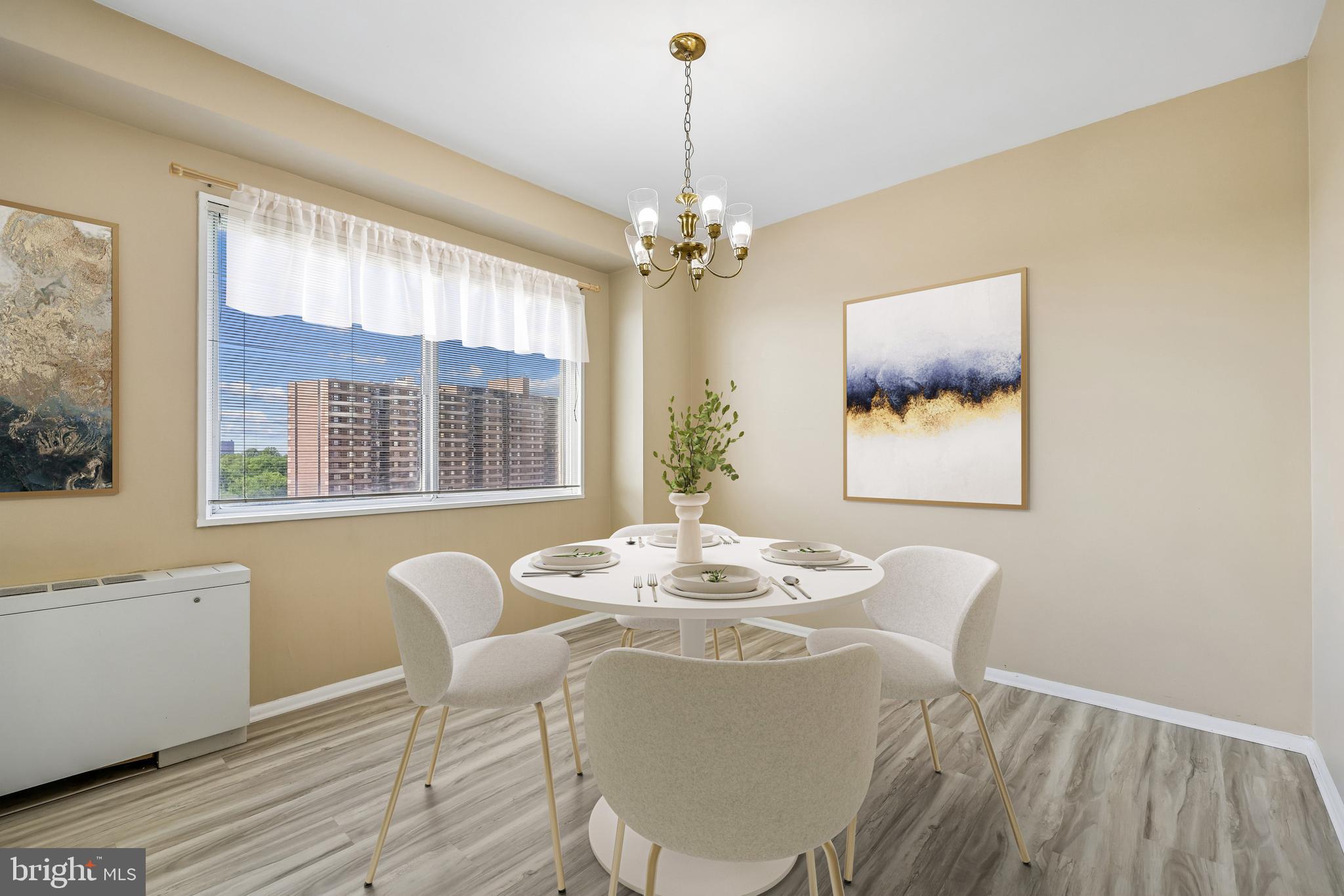 1111 University Boulevard West, Unit 1106A Silver Spring, MD 20902 - Photo 6 of 35 a dining room with furniture a chandelier and wooden floor