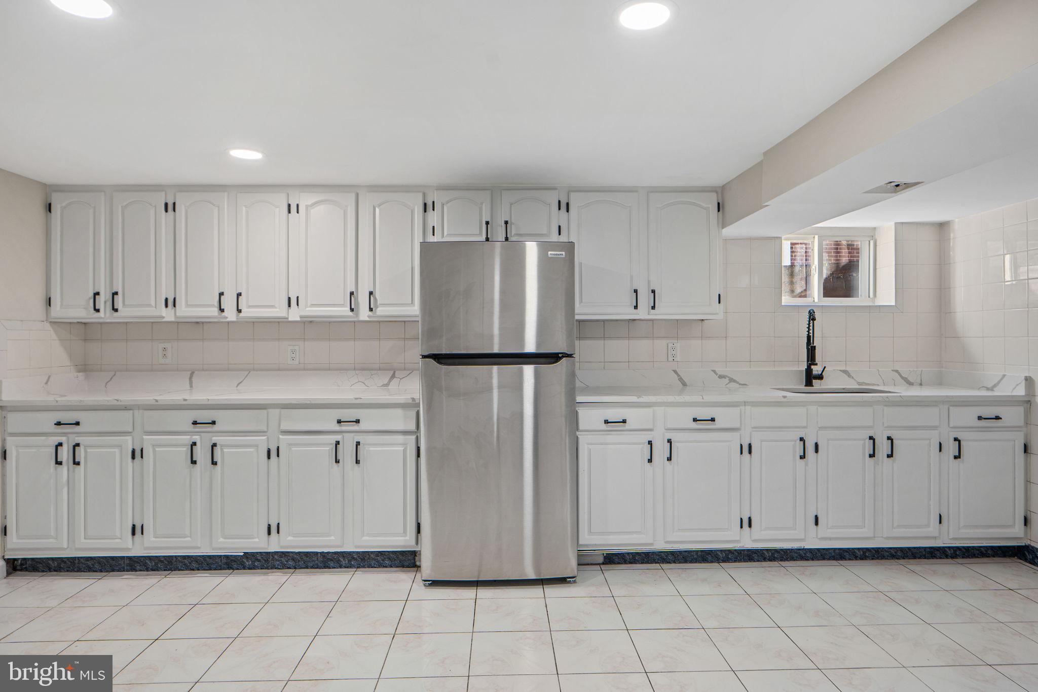 1513 Flora Lane Silver Spring, MD 20910 - Photo 29 of 49 a kitchen with white cabinets