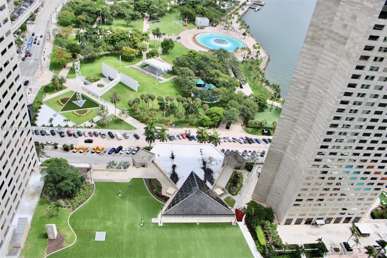 an aerial view of a house with a yard and potted plants